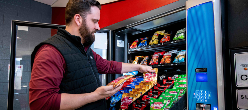 Person filling vending machine